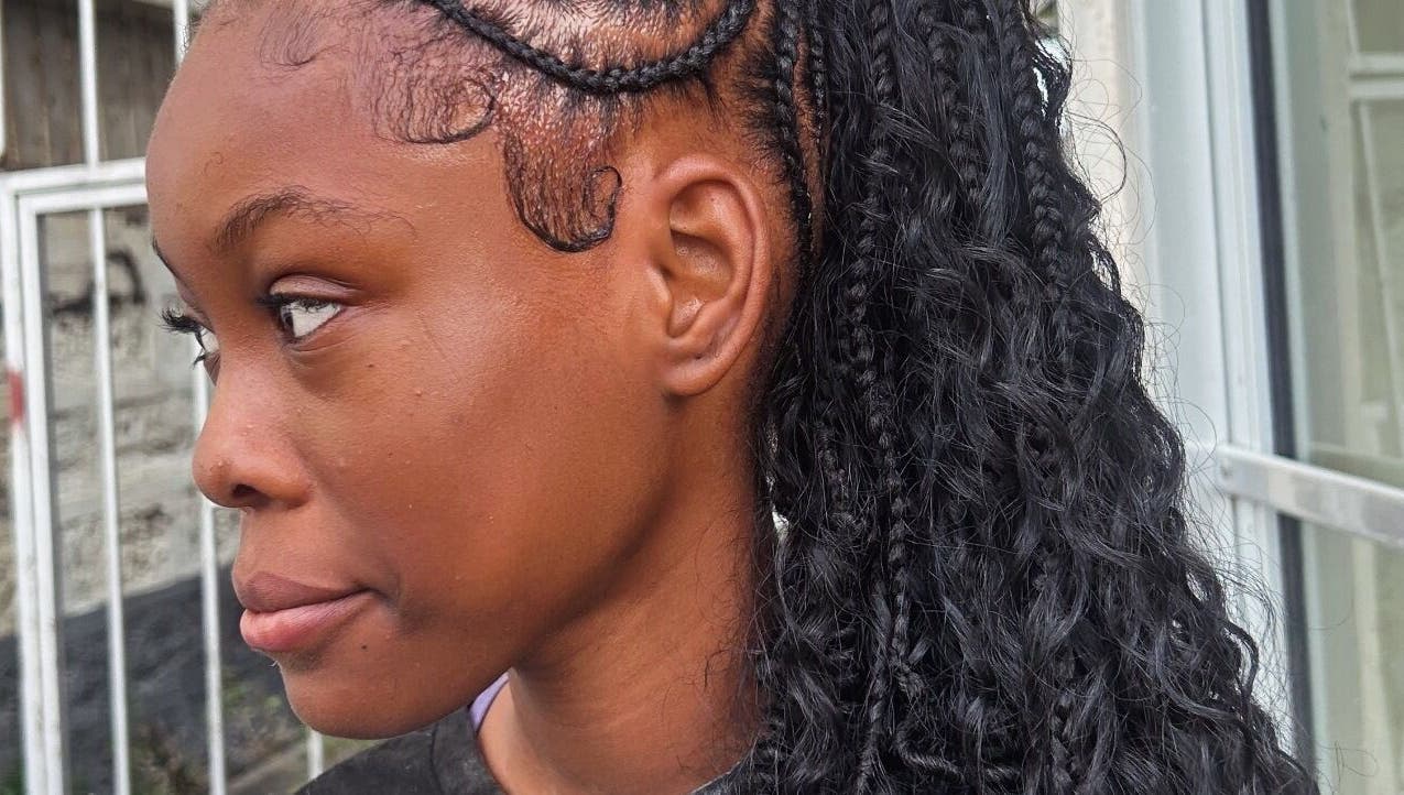 Intricate braided hairstyle at Di’s Hair Den in Bridgetown, BB, showcasing expert styling techniques.