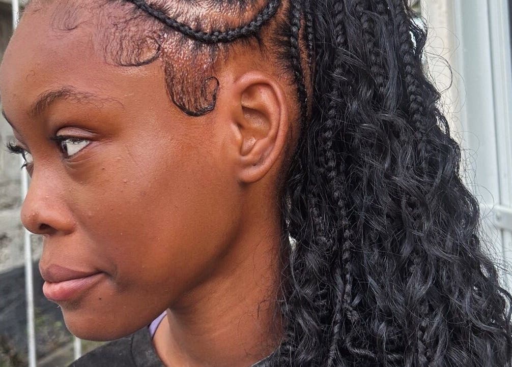 Intricate braided hairstyle at Di’s Hair Den in Bridgetown, BB, showcasing expert styling techniques.