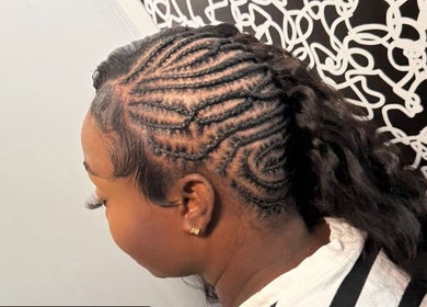 Detailed cornrow braids crafted at Di’s Hair Den in Bridgetown, BB, showcasing expert hairstyling.