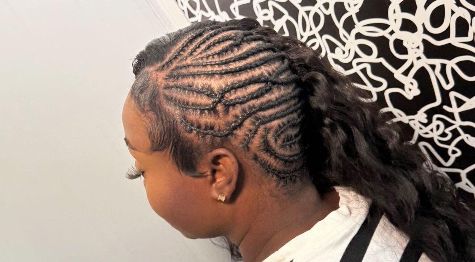 Detailed cornrow braids crafted at Di’s Hair Den in Bridgetown, BB, showcasing expert hairstyling.