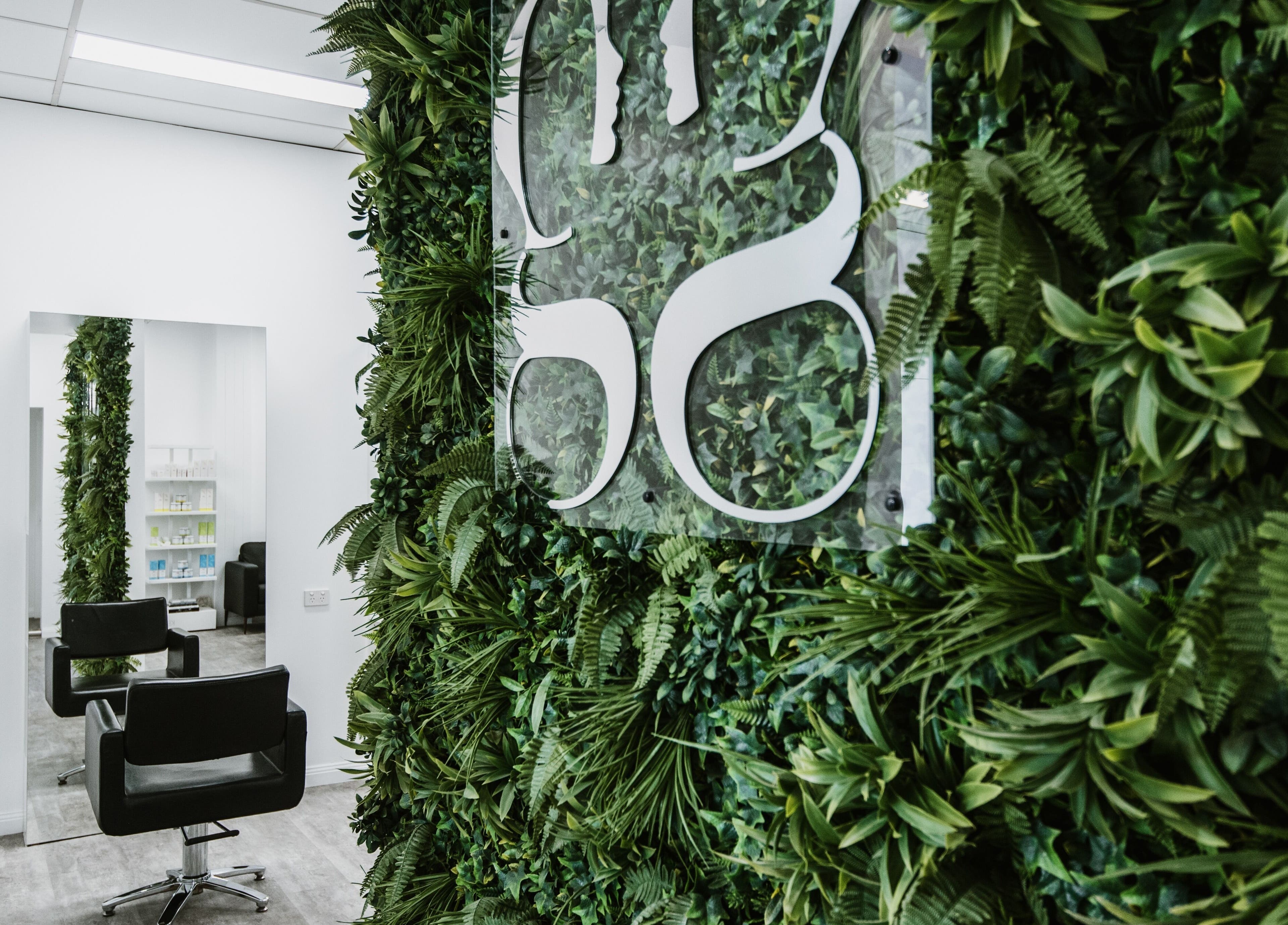 Lush greenery decor in Goddess Glow Tamworth salon, located in Tamworth, New South Wales, AU.