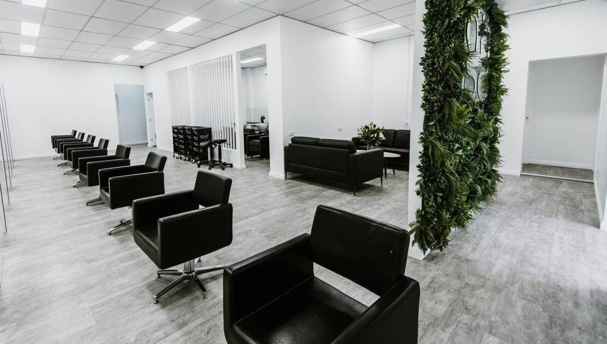 Sleek interior of Goddess Glow Tamworth, featuring stylish black chairs in Tamworth, New South Wales, AU.