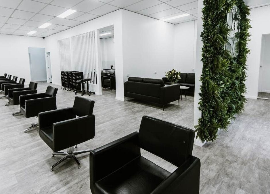 Sleek interior of Goddess Glow Tamworth, featuring stylish black chairs in Tamworth, New South Wales, AU.