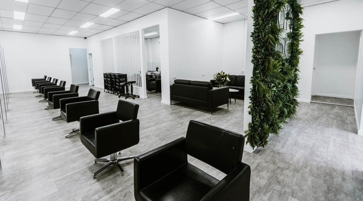 Sleek interior of Goddess Glow Tamworth, featuring stylish black chairs in Tamworth, New South Wales, AU.