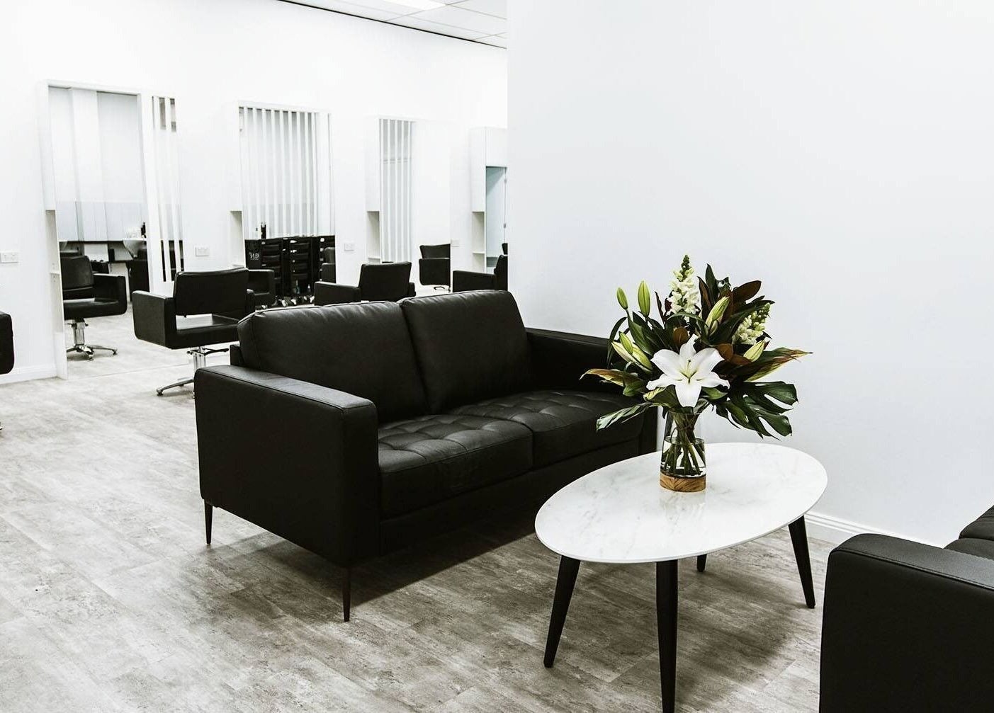 Modern salon interior at Goddess Glow Tamworth, Tamworth, New South Wales, AU featuring chic black seating.
