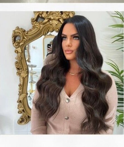 Hair styling at Styled by Jas in Bournemouth, England featuring elegant waves and a mirrored backdrop.