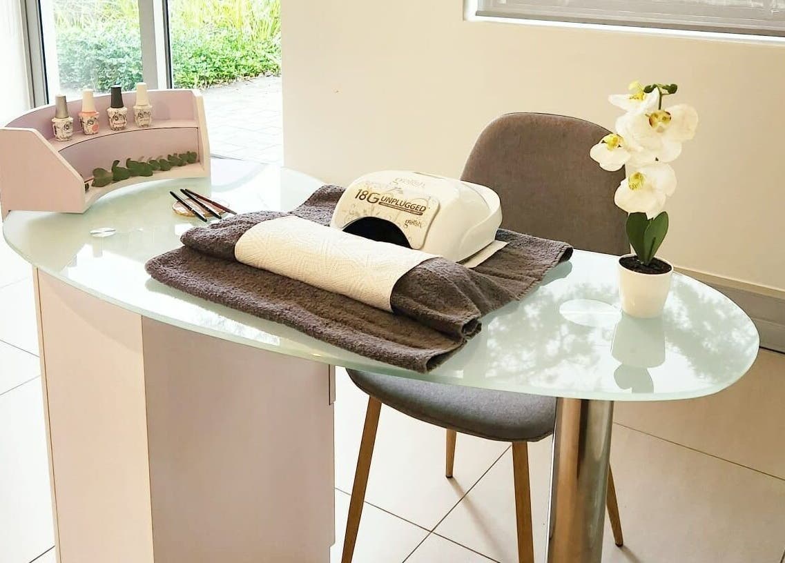 Nail treatment station at Chick Pulse Body and Skincare Durbanville, Cape Town, Western Cape, ZA featuring polish and decor.