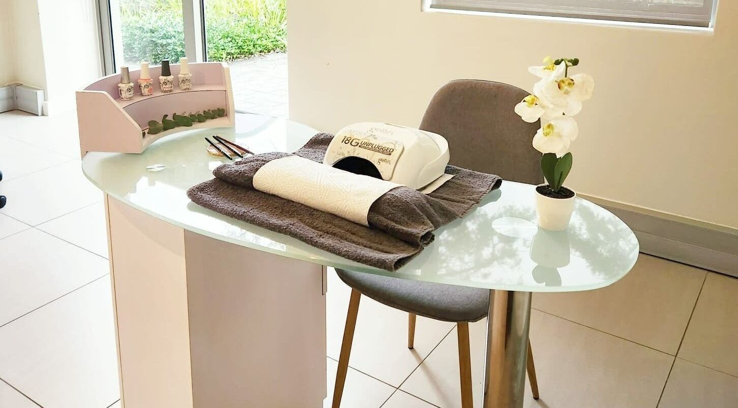 Nail treatment station at Chick Pulse Body and Skincare Durbanville, Cape Town, Western Cape, ZA featuring polish and decor.