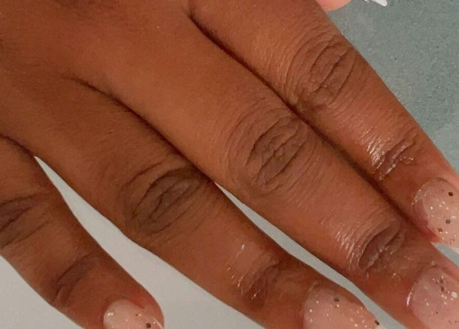 Close-up of a glittery manicure from Chick Pulse Body and Skincare Durbanville, Cape Town, Western Cape, ZA.