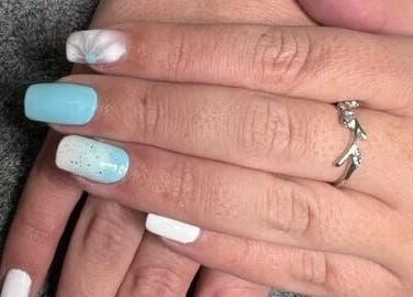 Elegant nail art with light blue and white polish at Chick Pulse Body and Skincare Durbanville, Cape Town, ZA.