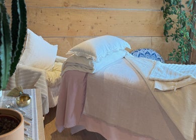 Relaxing therapy room at Cedar Cabin Therapies in Holmfirth, England, GB, featuring a comfortable massage bed.