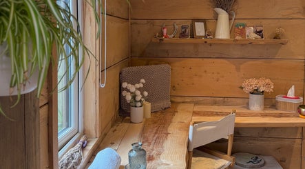Cozy natural wood interior at Cedar Cabin Therapies, Holmfirth, England, GB, featuring calm decor.