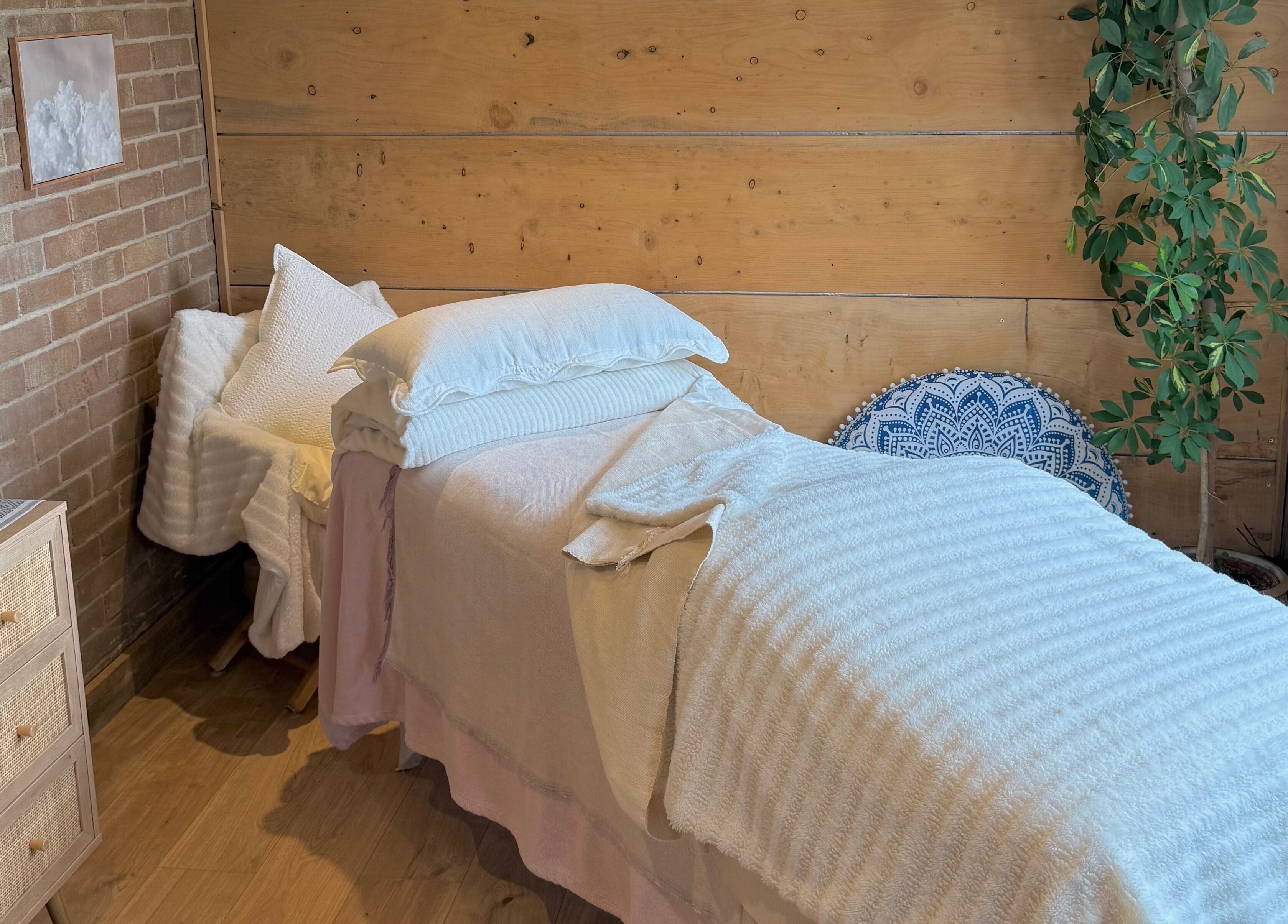 Serene therapy room at Cedar Cabin Therapies, Holmfirth, England, GB, featuring a peaceful bed setup.