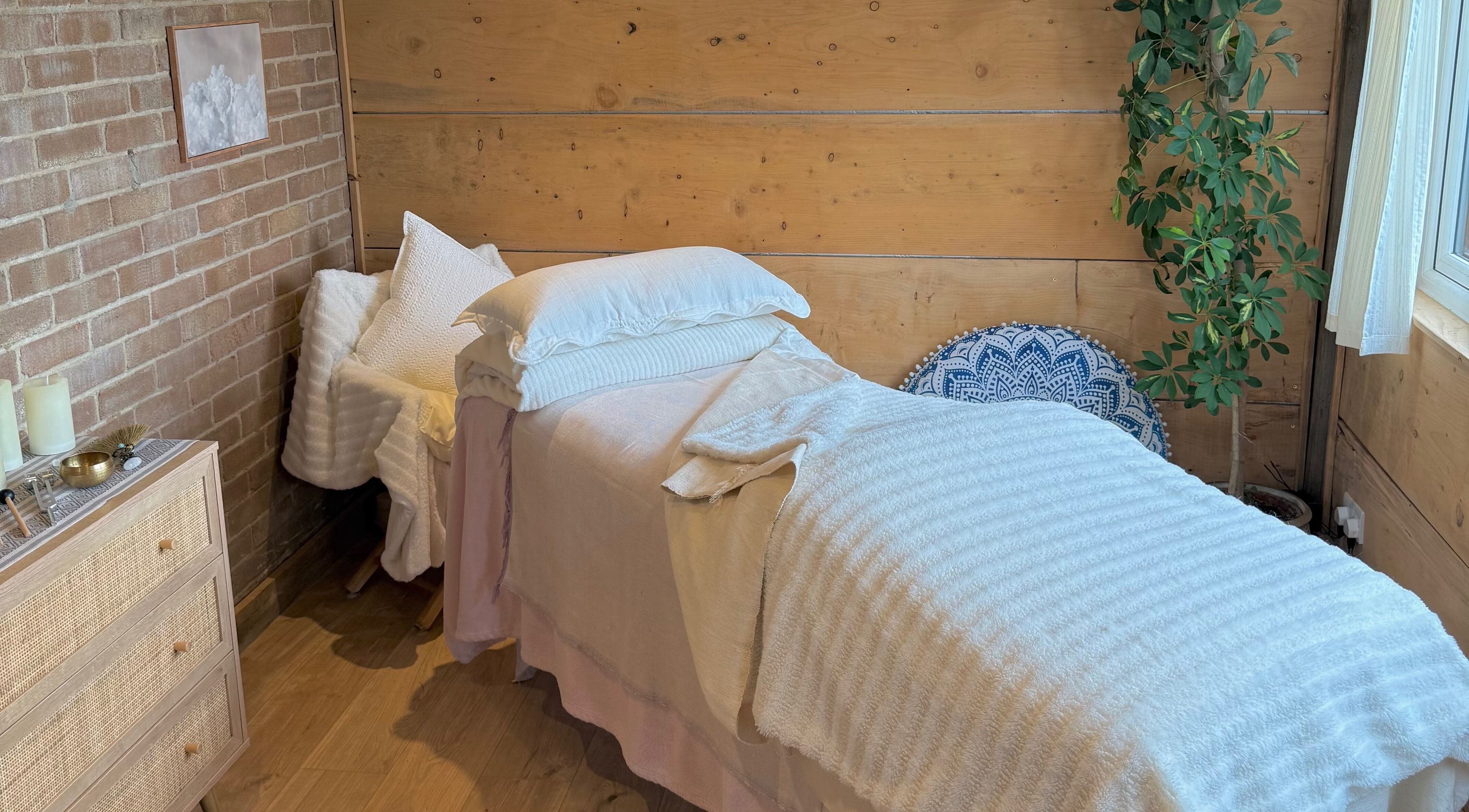 Serene therapy room at Cedar Cabin Therapies, Holmfirth, England, GB, featuring a peaceful bed setup.