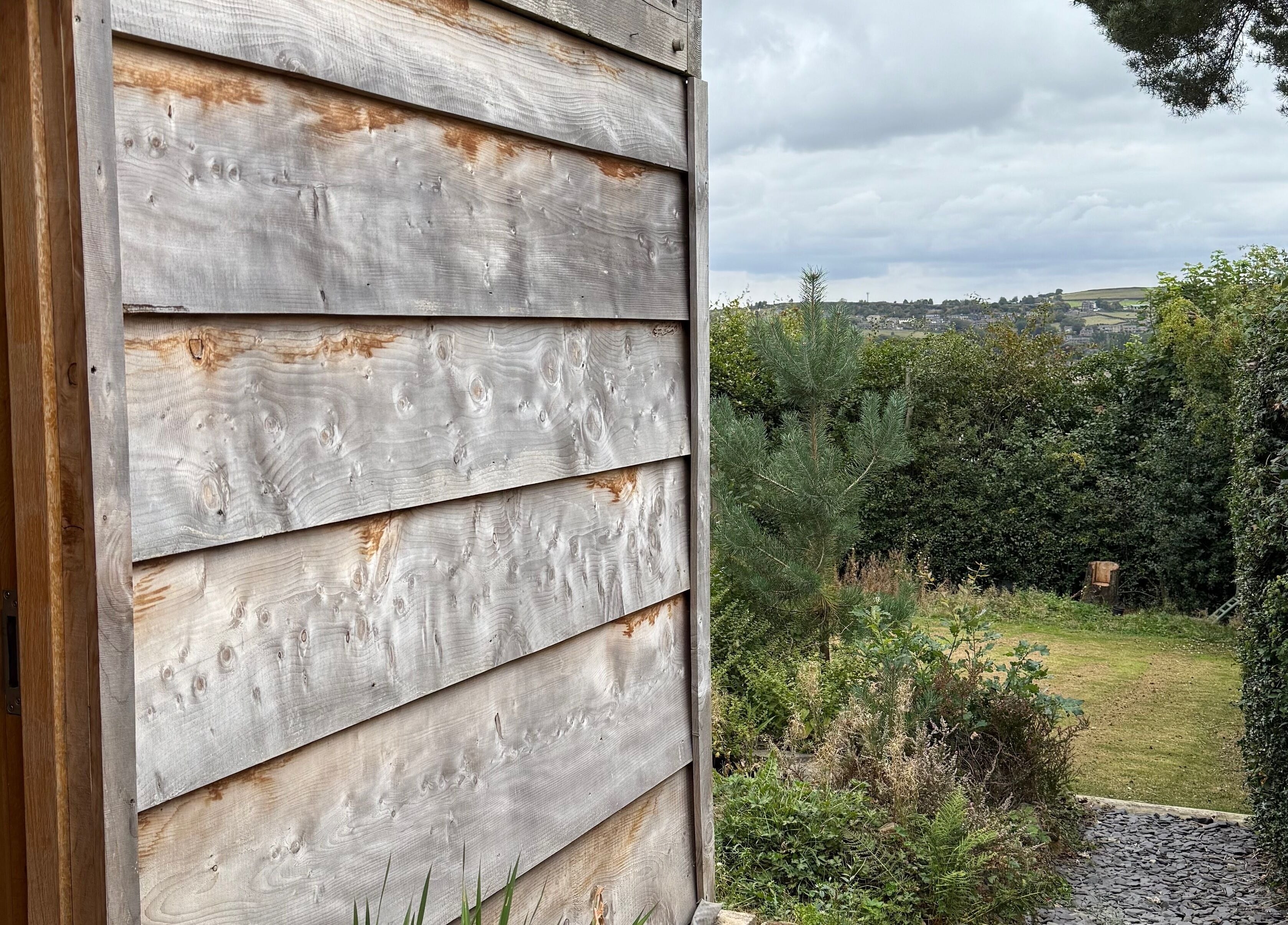Cedar Cabin Therapies entrance with serene garden view in Holmfirth, England, GB.