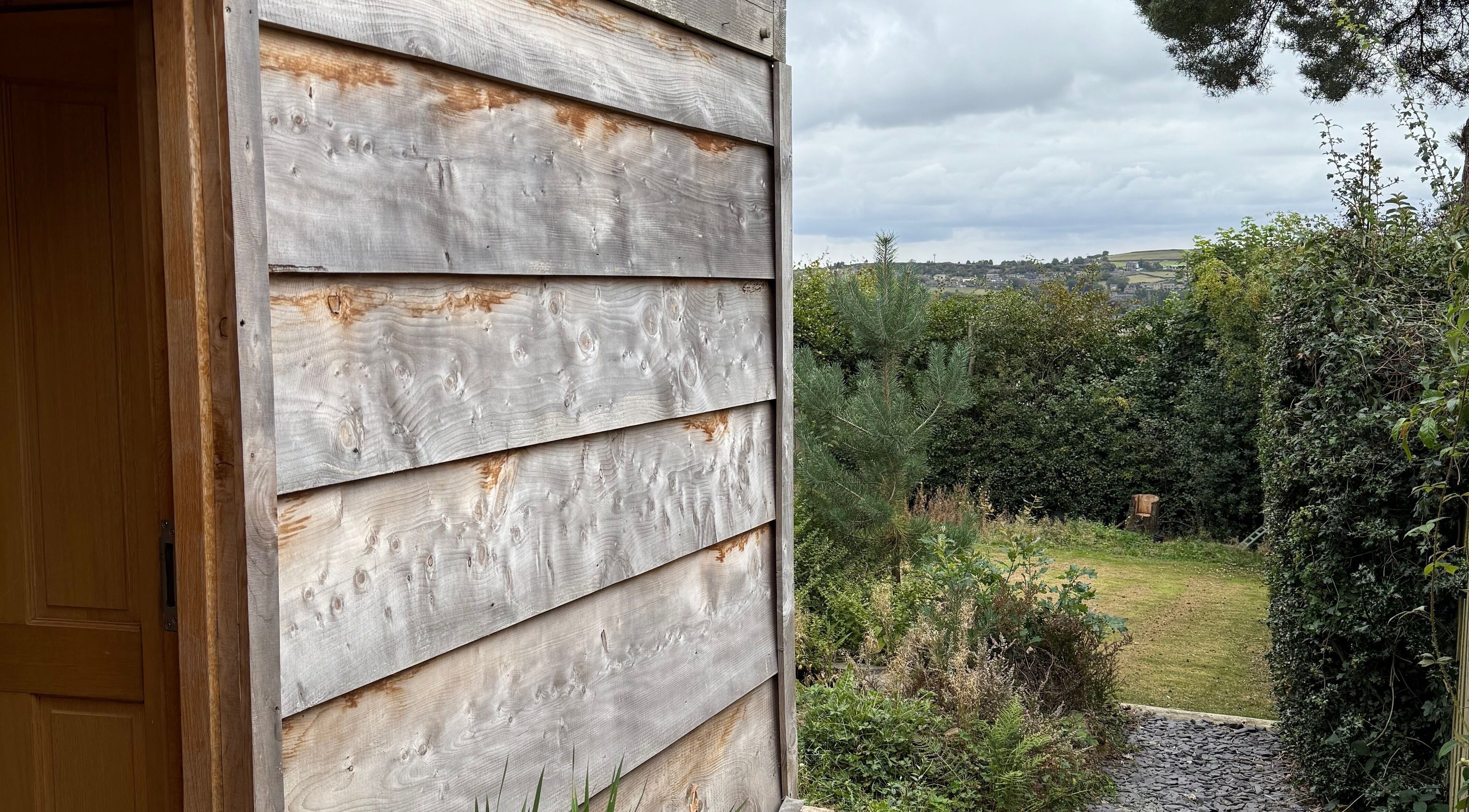 Cedar Cabin Therapies entrance with serene garden view in Holmfirth, England, GB.