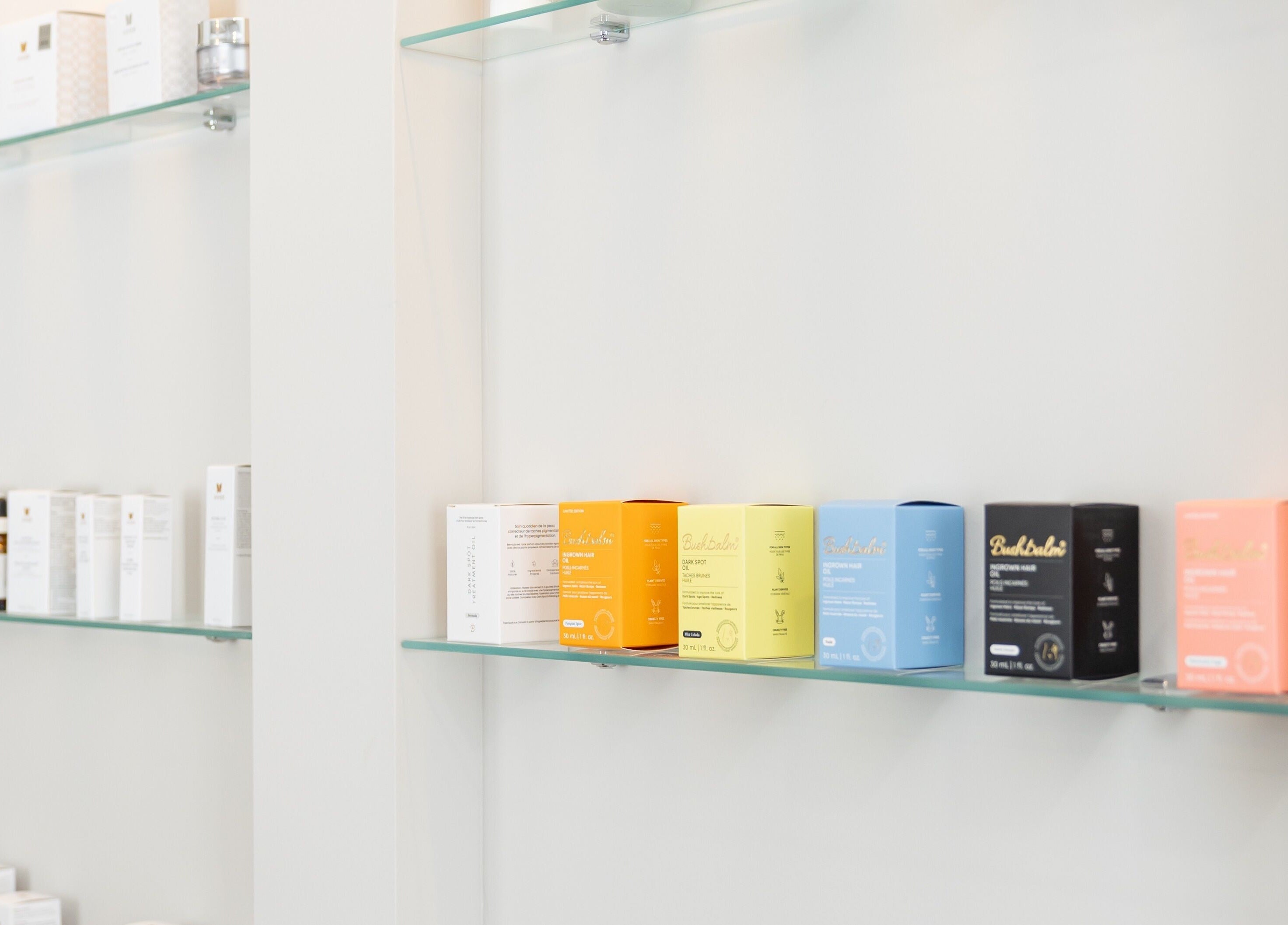 Colorful skincare products on glass shelves at The Babe Cave in Hanover, Ontario, CA.