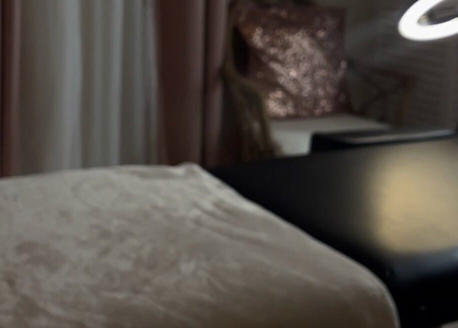 Cozy massage table at Winx by Savs, Westmoreland, Saint James, BB with soft lighting.