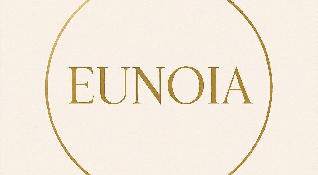 Logotipo de EUNOIA en Curridabat, San José, CR, destacando en un elegante diseño dorado.