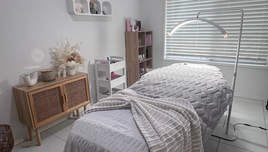 Tranquil treatment room at Glamour Goddess Lashes in Bonogin, Queensland, AU, featuring a cozy bed and soft lighting.