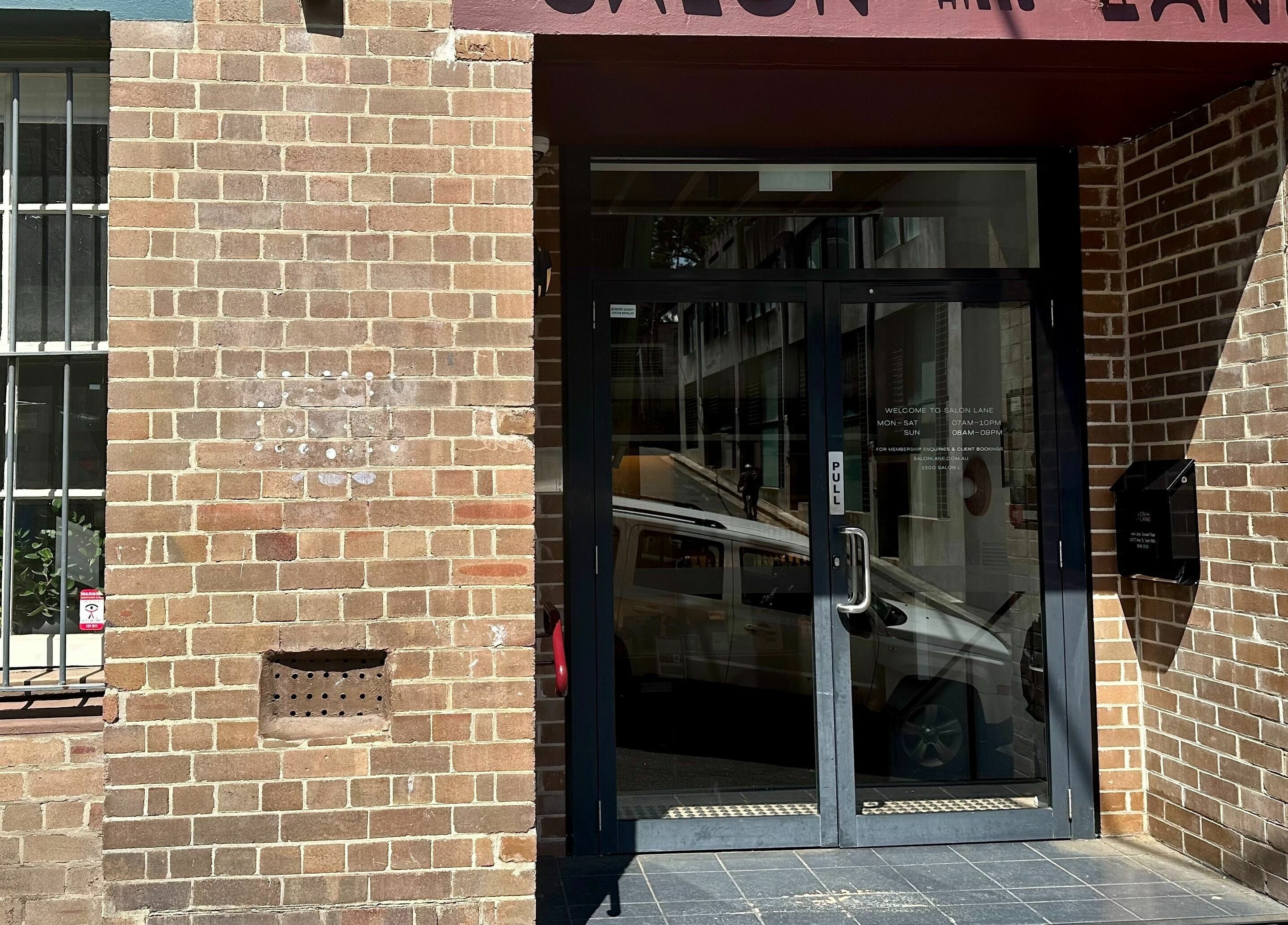 Entrance to Stuart Bane Colour in Surry Hills, New South Wales, AU, featuring a stylish brick facade.