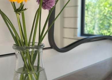 Vase with flowers at Sarah Freeman Hair-Grey Blending Specialist, Polegate, England, GB.