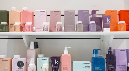 Shelf of vibrant hair products at Sarah Freeman Hair-Grey Blending Specialist, Polegate, England, GB.