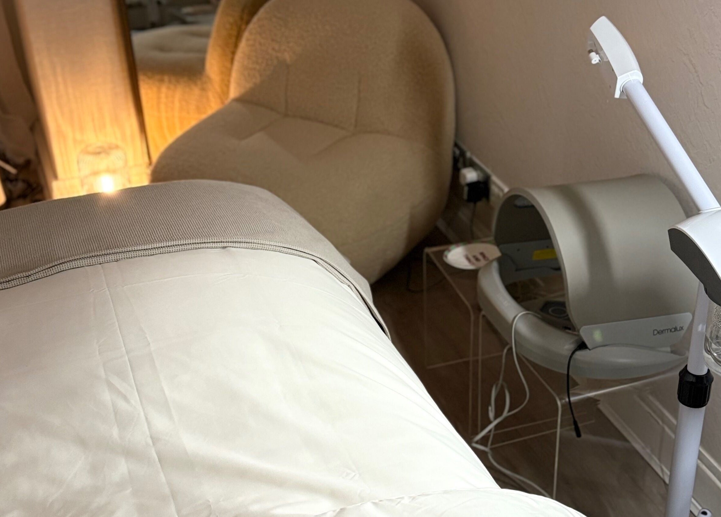 Cozy treatment room at Chloe Proud, Berkhamsted, England, GB, featuring a relaxation chair and modern equipment.