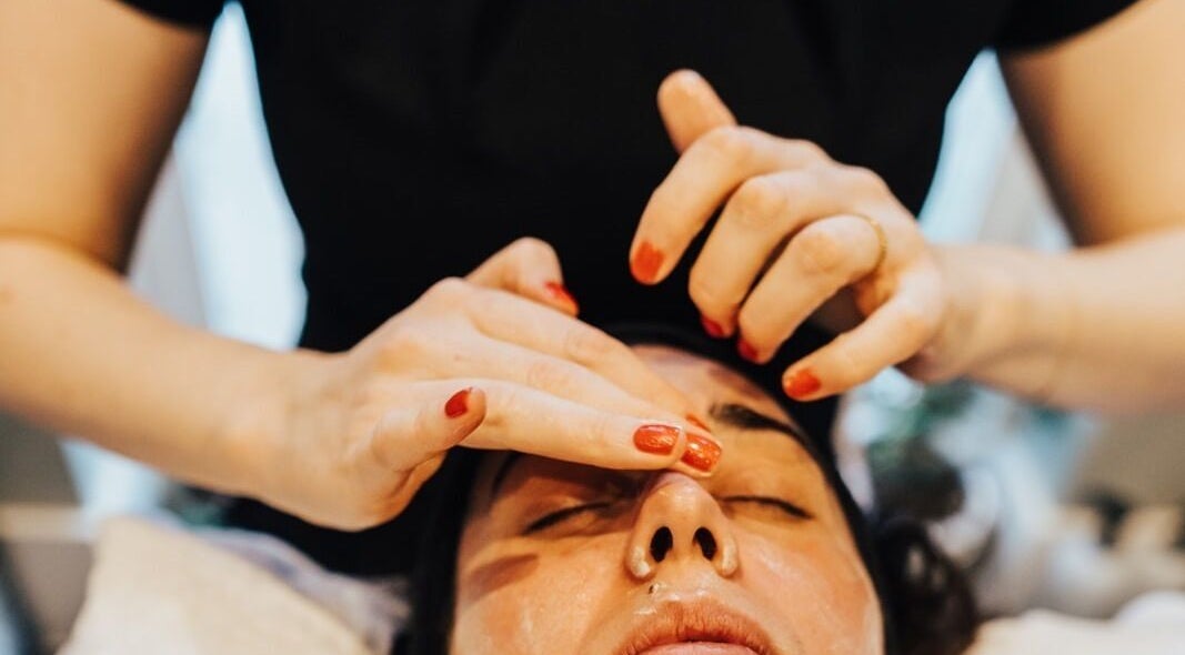 Facial treatment at Chloe Proud, Berkhamsted, England, GB showcasing expert massage techniques.