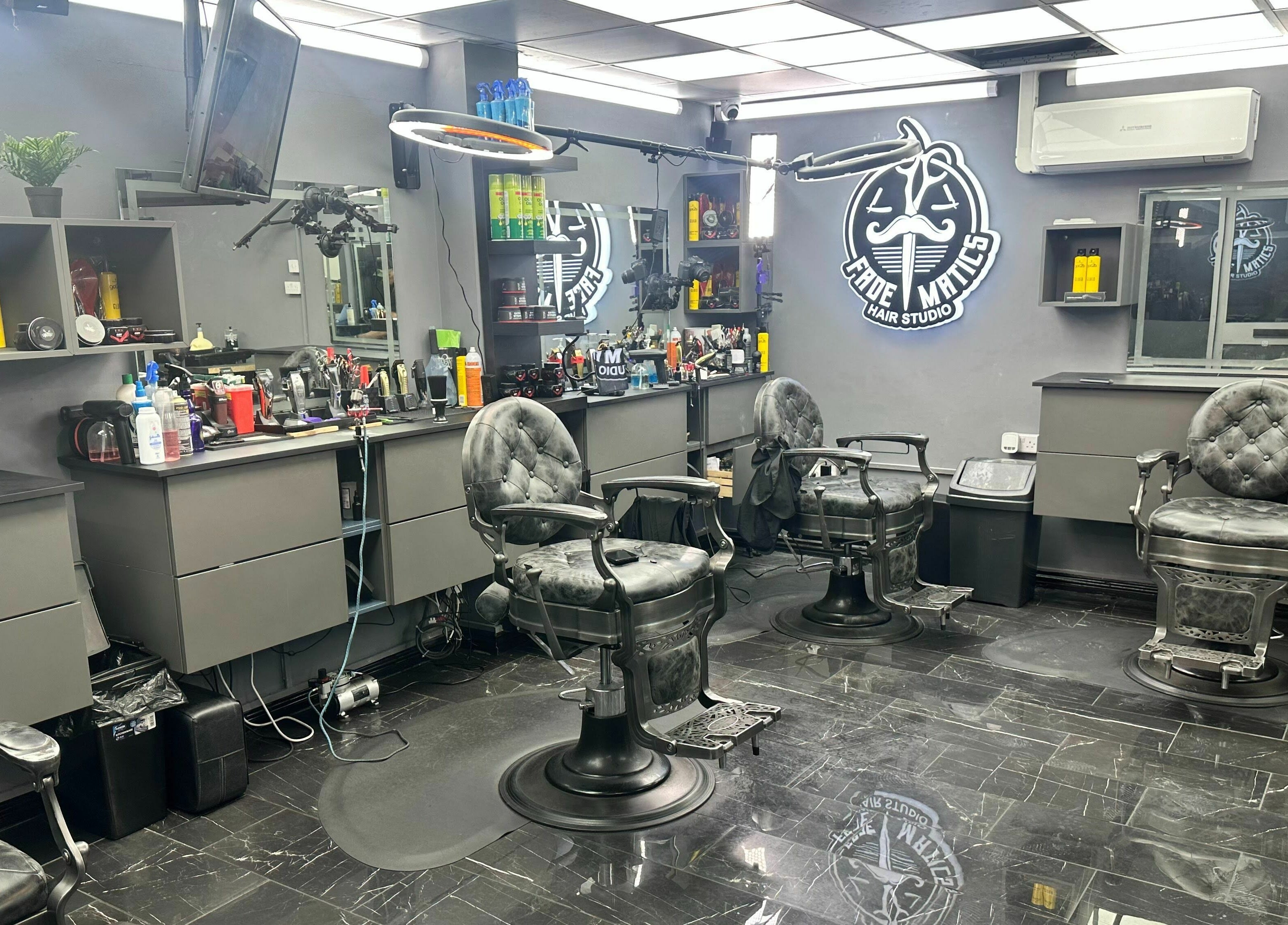 Modern barber chairs and sleek decor at Fade Matics, Dagenham, England, GB beauty and wellness venue.
