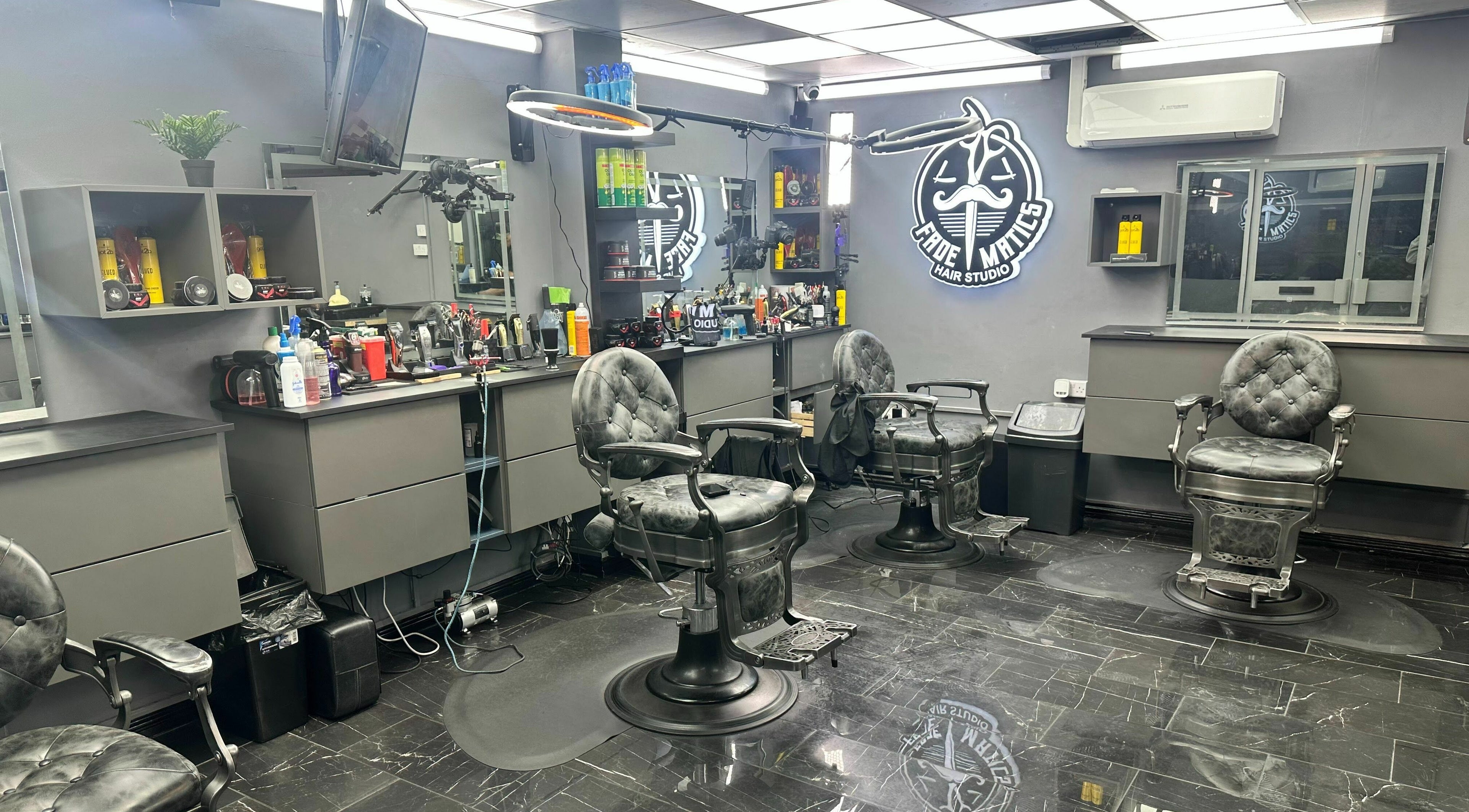 Modern barber chairs and sleek decor at Fade Matics, Dagenham, England, GB beauty and wellness venue.