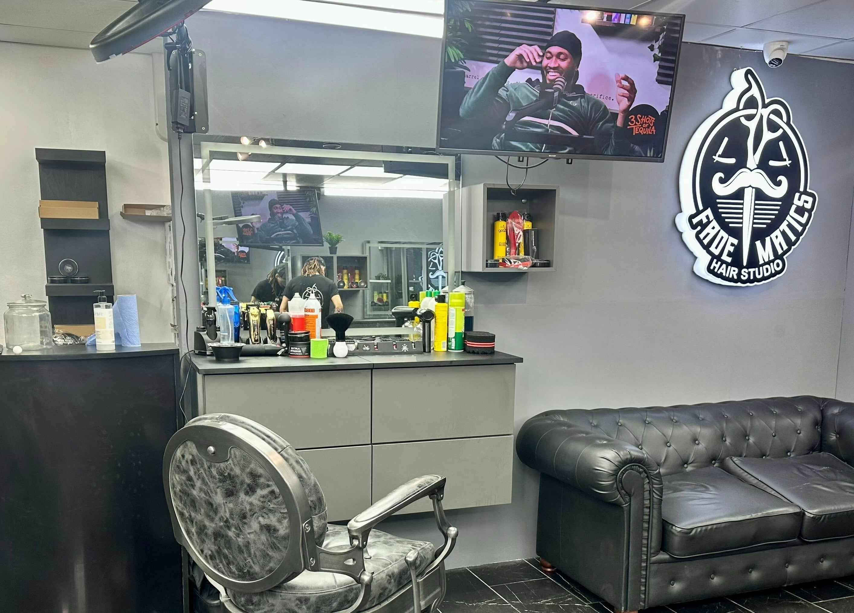 Modern interior of Fade Matics hair studio in Dagenham, England, GB, showcasing sleek design and comfort.