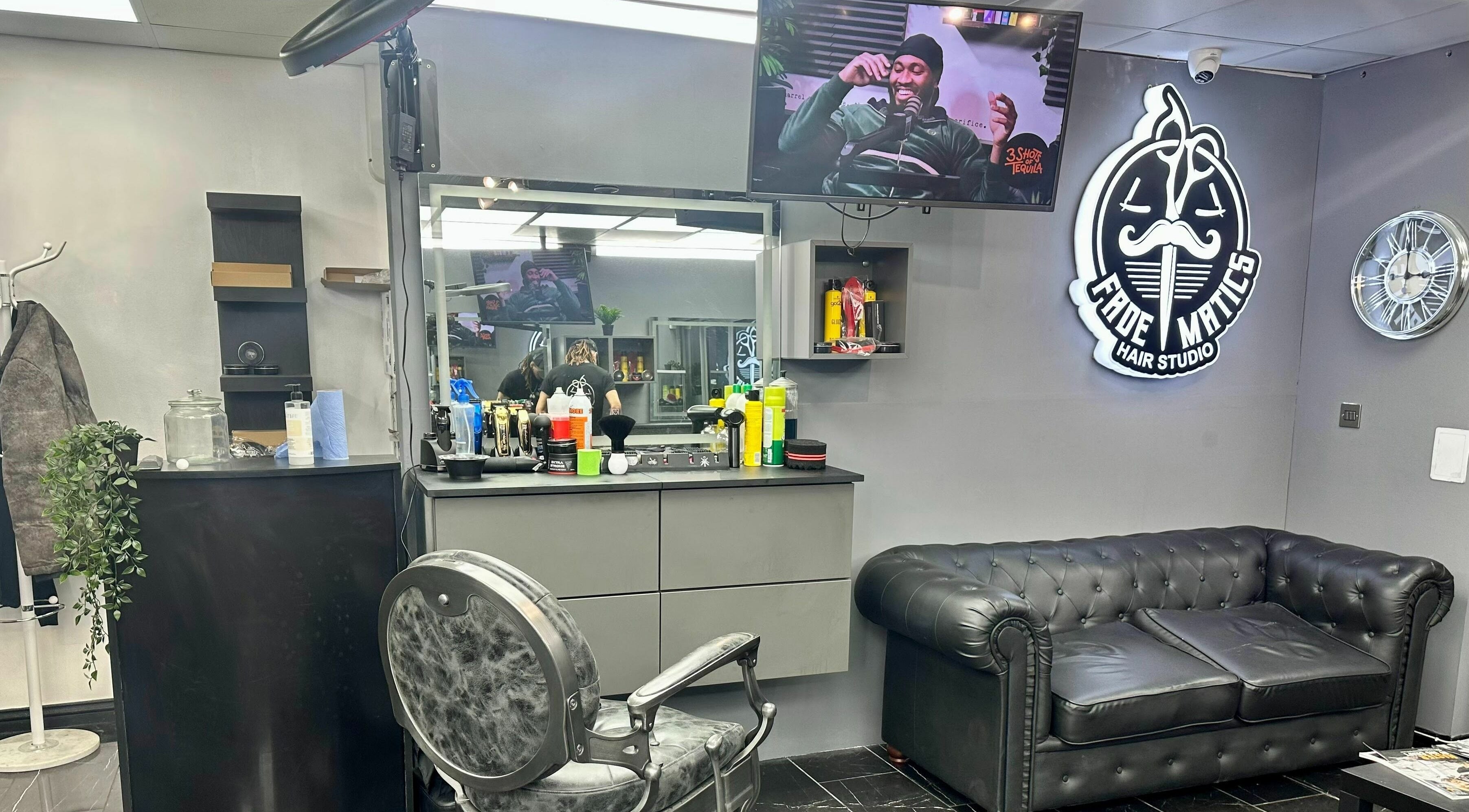 Modern interior of Fade Matics hair studio in Dagenham, England, GB, showcasing sleek design and comfort.