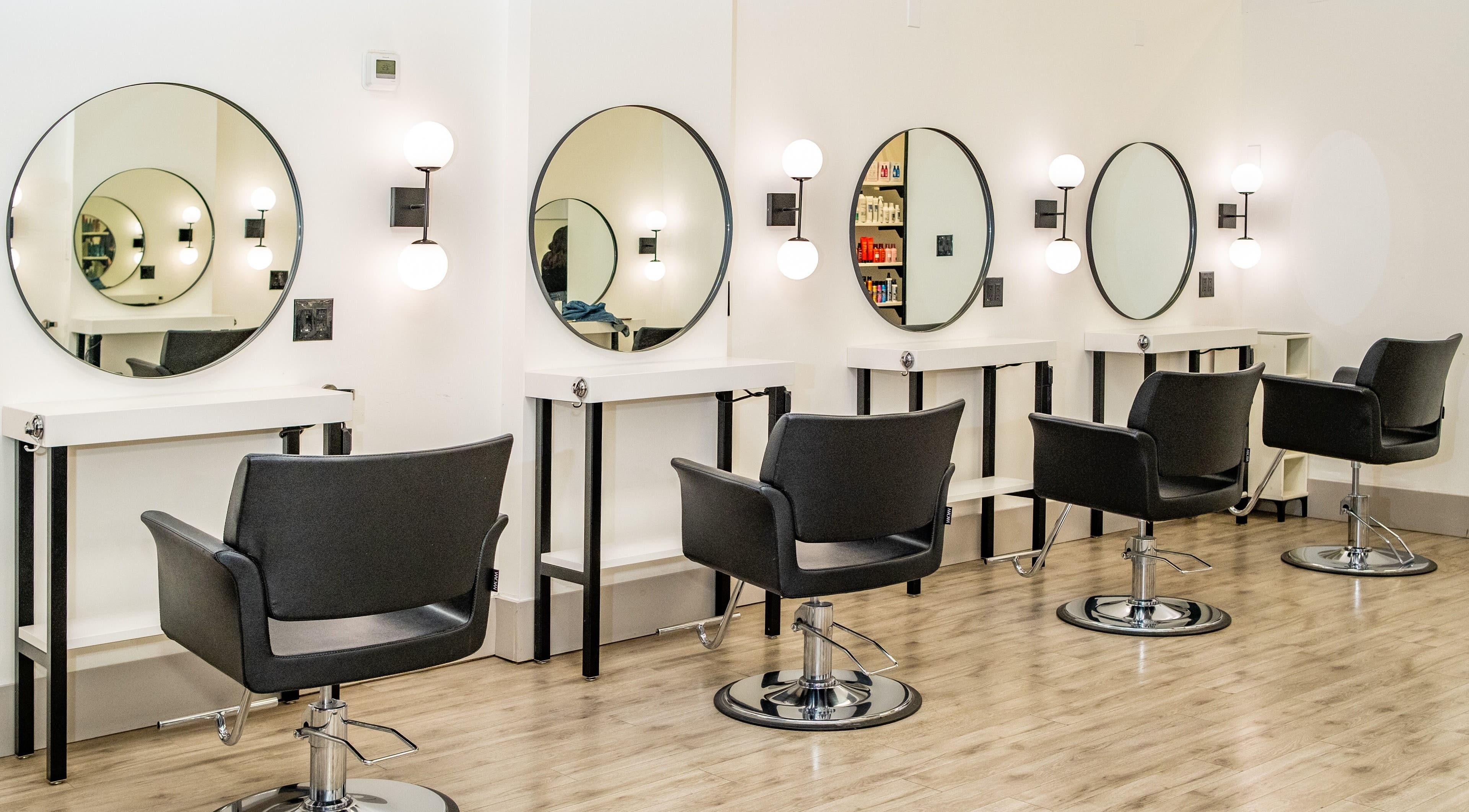 Modern styling stations at Red Lemon Hair Salon, Halton Hills, Ontario, CA with sleek design and ambiance.