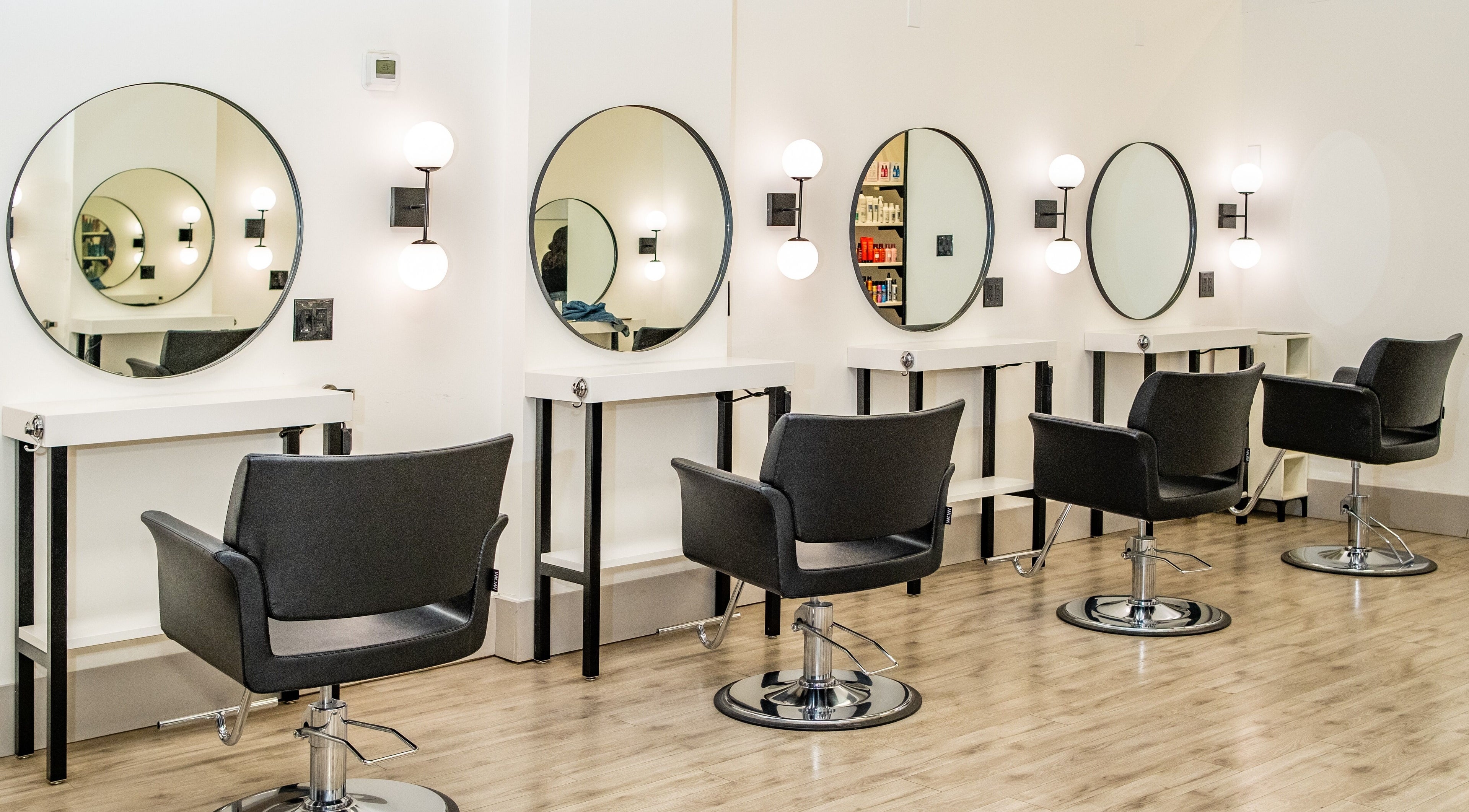 Modern styling stations at Red Lemon Hair Salon, Halton Hills, Ontario, CA with sleek design and ambiance.