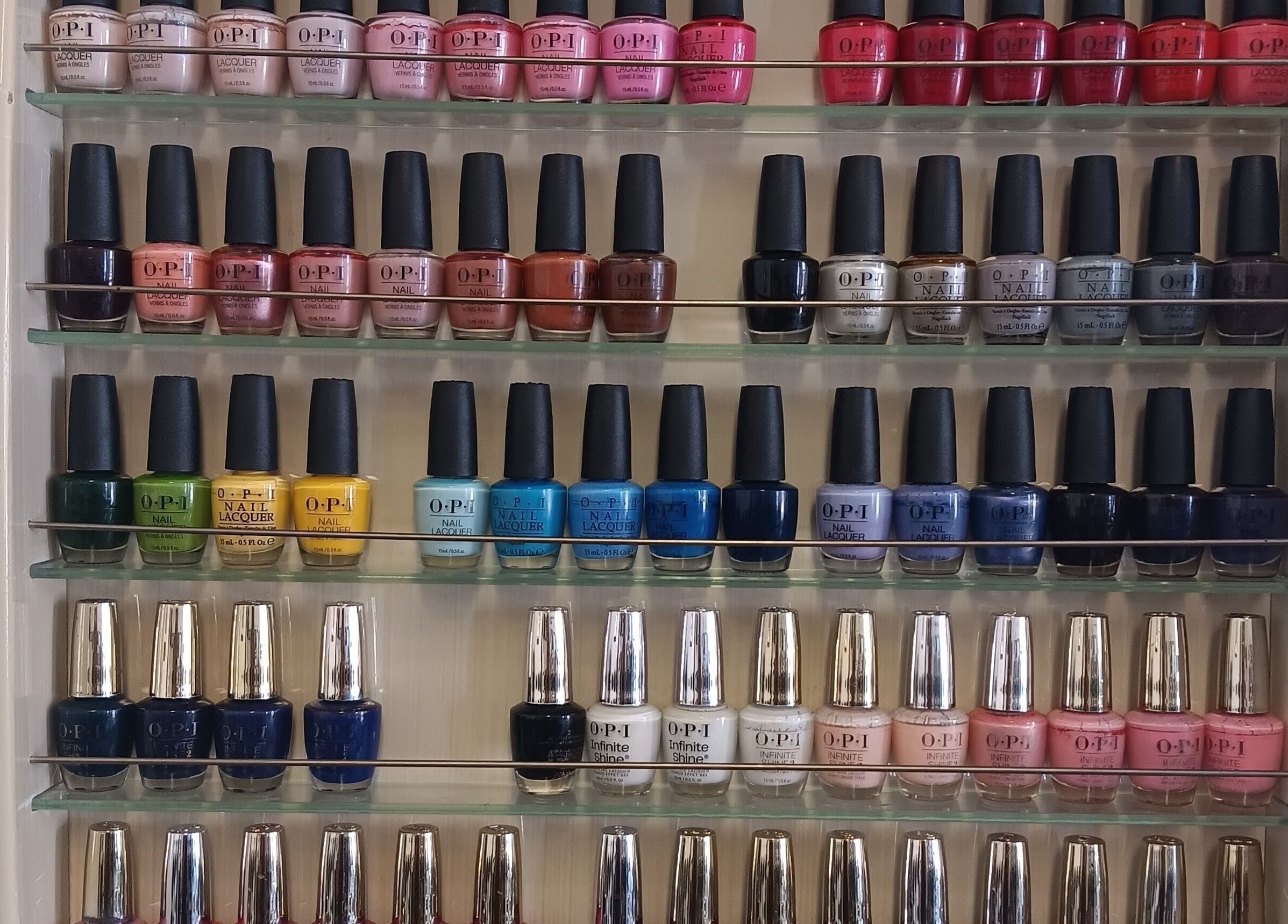 Wide selection of nail polishes at Ke's Nail Care in Oakland, California, US, showcasing vibrant colors.
