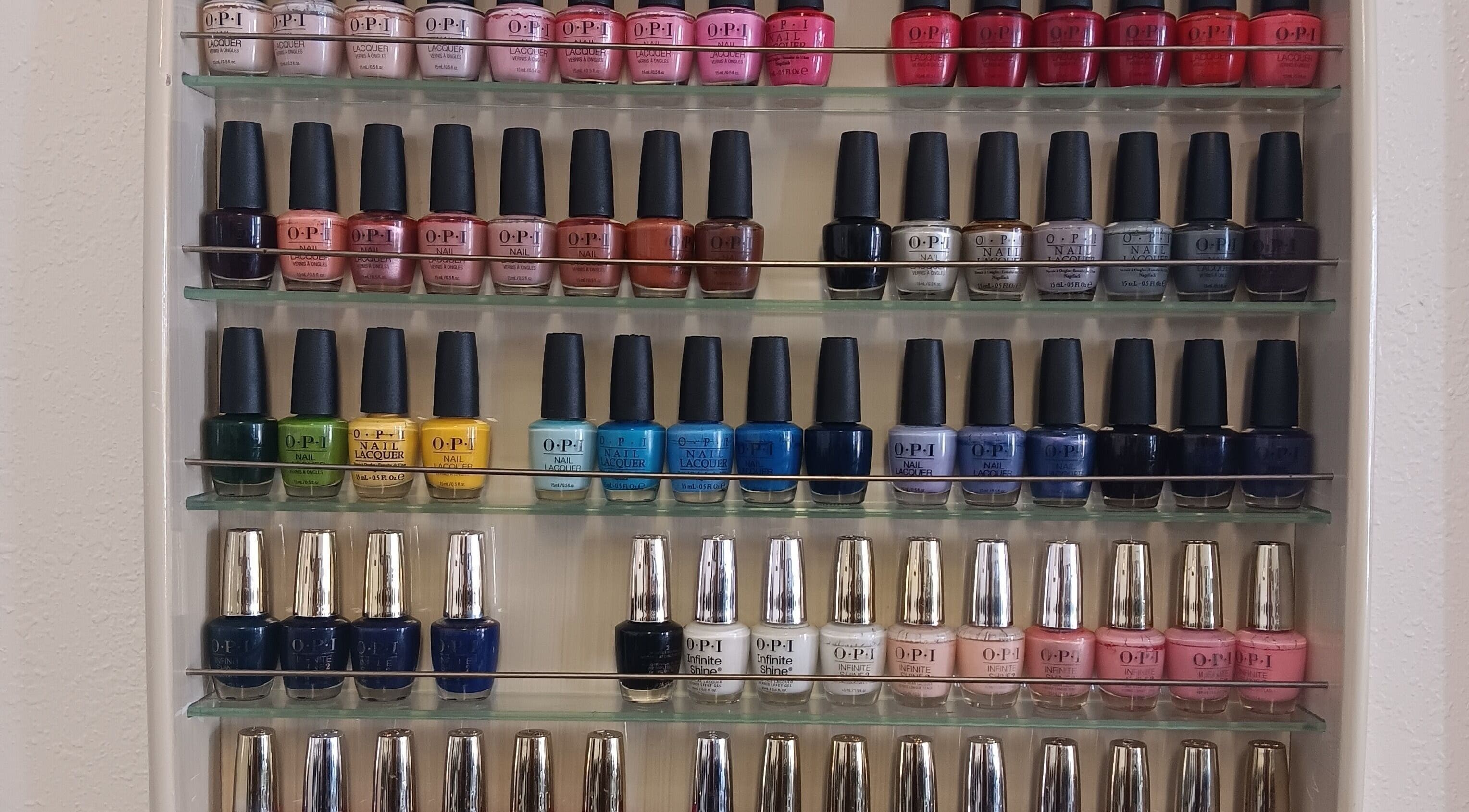 Wide selection of nail polishes at Ke's Nail Care in Oakland, California, US, showcasing vibrant colors.