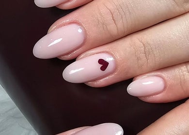 Elegant manicured nails with heart design at GELuxe Nail Studio, Dapto, New South Wales, AU.