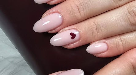 Elegant manicured nails with heart design at GELuxe Nail Studio, Dapto, New South Wales, AU.