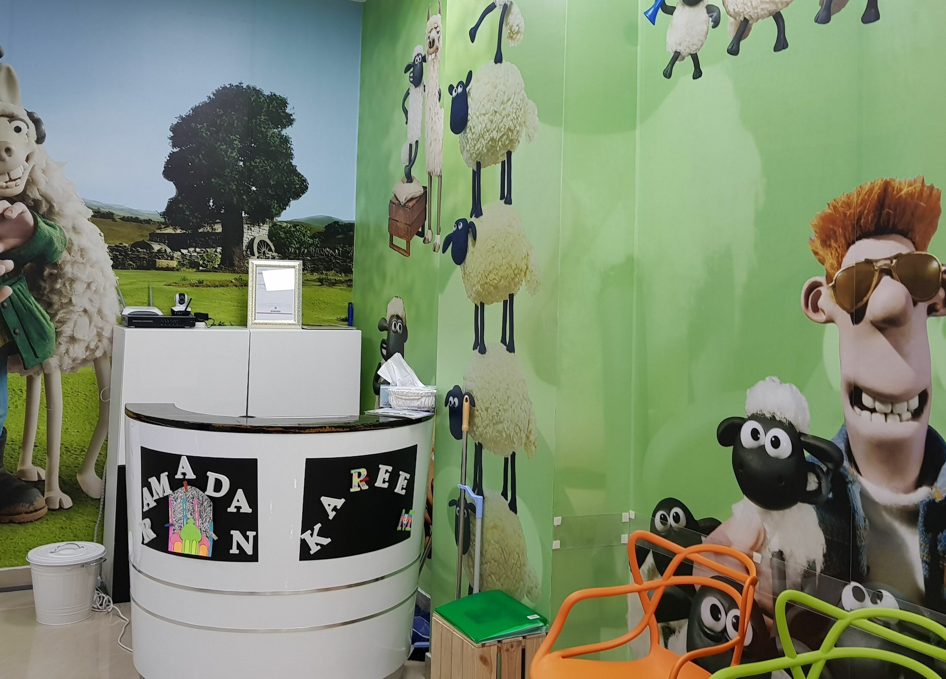Colorful cartoon-themed lobby of White Sheep Kids Salon in Abu Dhabi, Abu Dhabi, AE with fun decor.