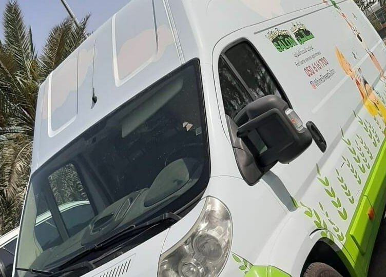 White Sheep Kids Salon's branded van in Abu Dhabi offering mobile services, enhancing convenience.