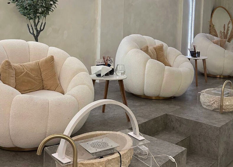 Elegant seating at Boho Bliss, Bali, Bali, ID, offers plush comfort in a serene, modern setting.