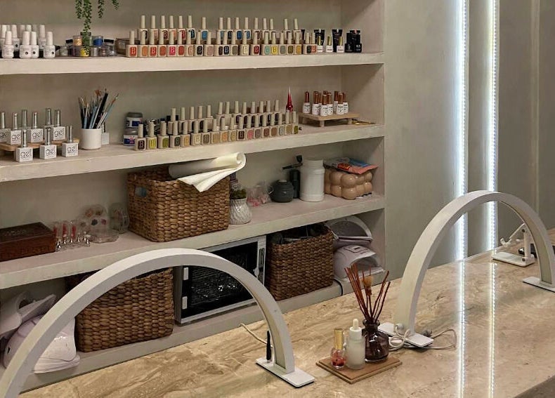 Nail polish shelves at Boho Bliss, Bali, Bali, ID. A serene setting for a manicure.