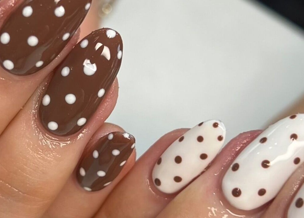 Elegant polka-dot nail art at Nailedit Bymillie, Burnley, England, GB. Perfect for a chic, trendy look.