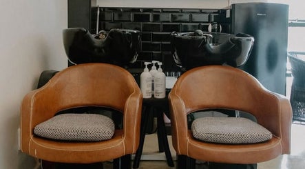 Elegant wash stations at Blow Dry Bar - Garsfontein, Pretoria, Gauteng, ZA, featuring chic brown chairs.