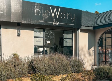 Front view of Blow Dry Bar - Garsfontein in Pretoria, Gauteng, ZA highlighting stylish windows and signage.