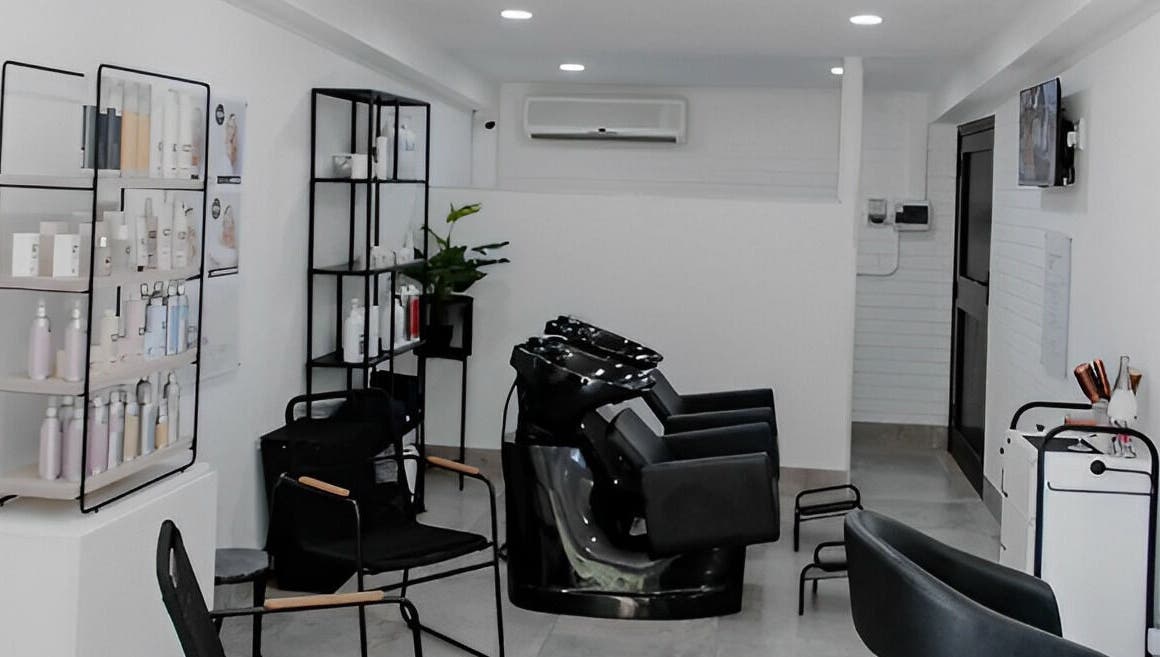 Modern interior of Blow Dry Bar - Silver Lakes in Shere, Gauteng, ZA. Stylish salon setup with hair wash stations.