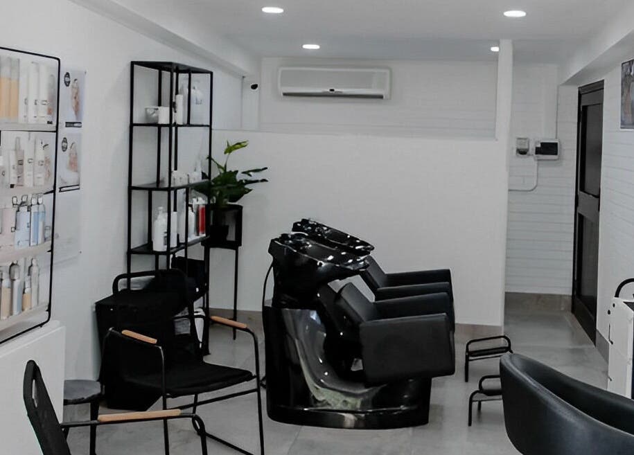 Modern interior of Blow Dry Bar - Silver Lakes in Shere, Gauteng, ZA. Stylish salon setup with hair wash stations.
