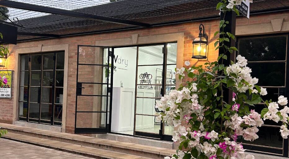 Elegant exterior of Blow Dry Bar - Silver Lakes in Shere, Gauteng, ZA adorned with blooming flowers.