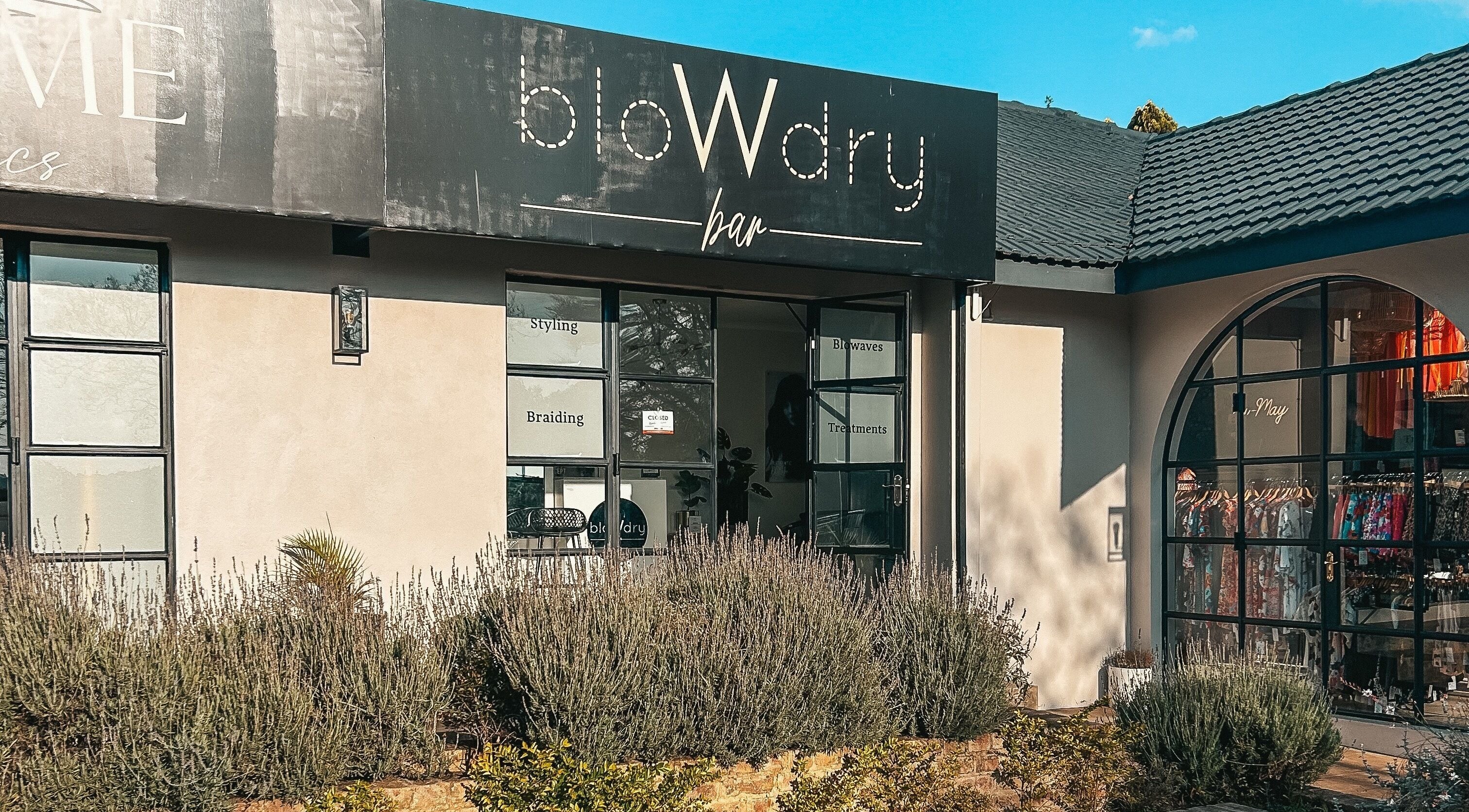 Exterior view of Blow Dry Bar - Garsfontein in Pretoria, Gauteng, ZA with stylish signage.